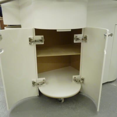 Wheeled Corain Point Of Sale Unit with concealed corner stool.